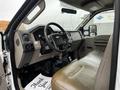 Interior of a 2008 Ford F-450 SD showing beige seating steering wheel and dashboard with various controls visible