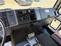 Interior view of a 1994 Volvo FE 42 featuring a dashboard with various controls gauges and a central console with a radio and communication equipment