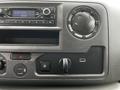Dashboard controls of a 2021 Ford E-450 featuring a radio display climate controls and USB ports