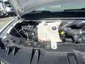 A 2007 Chevrolet Express engine compartment showing the coolant reservoir and various engine components