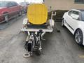 A 2014 Express 8 Foot Trailer with a yellow tank on top and a hitch at the front for towing