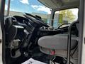 Interior view of a 2020 Hino 338 showing the driver's seat and steering wheel with a dashboard visible in the foreground