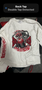 White long-sleeve shirt featuring a graphic of a skull wearing a helmet and a gun with "Big Red Machine" in bold red lettering
