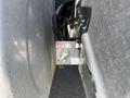 A metal switch marked OFF attached to a panel on a 2009 International 7500 truck