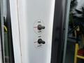 Control panel with switches labeled for opening and closing a door and for stowing and deploying a ramp