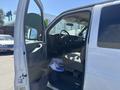 A 2007 Chevrolet Express van with an open driver's side door revealing the interior and dashboard