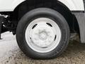Close-up of the wheel of a 2014 International TerraStar featuring a white rim with multiple lug nuts and a black tire with visible tread markings
