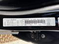 A black 2019 RAM 1500 with visible details on a manufacturer label including specifications and weights