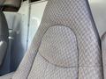 Close-up view of a patterned fabric seat from a 2009 Chevrolet Express with a contoured shape and visible stitching details