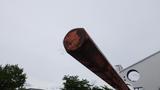 A close-up of a rusty metal beam extending from a structure possibly related to a 2012 International 7400 truck