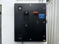 A black Huntair Custom Air Handler Unit with model number RAH-465 and a red power button is displayed on a metal panel