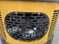 Front view of a 2024 AGT Industrial Yellow H13R Mini Excavator's engine cover featuring a black mesh grill design