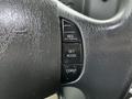 Steering wheel of a 2011 Ford Econoline with buttons labeled RES SET ACCEL and COAST