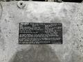 A 2022 Isuzu NPR engine information plate displaying specifications such as engine family, model, displacement, and fuel requirements