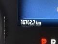 Close-up of a digital odometer reading 16762.7 km in a 2023 Ford F-250