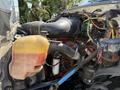 2008 Ford F-750 engine with visible components including a coolant reservoir hoses and wiring