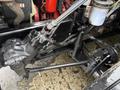 A 2011 Ford F-650 chassis showcasing the engine components and steering mechanism with visible hydraulic lines and metal parts