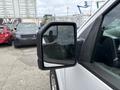 A 2018 Ford F-150 showing the driver's side mirror with reflective glass and a black casing
