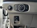 Dashboard controls of a 2021 Ford Transit showing knobs and buttons for lights and various functions