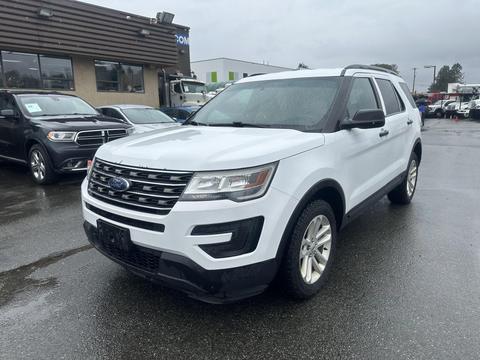 A white 2016 Ford Explorer parked with its front facing the viewer displaying a chrome grille and alloy wheels