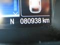 A close-up of the dashboard of a 2015 Ford Escape displaying the odometer reading of 80938 km
