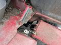 Close-up view of a 2012 Toro Groundsmaster 5910 with visible mechanical components and red surface detailing showing dirt and wear