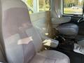 Interior view of a 2011 International 7500 with two gray seats designed for a heavy-duty truck