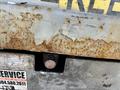 Close-up of a weathered 2010 SkyJack SJ with rusted metal surfaces and a faded service sticker partially visible