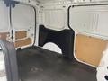 Interior of a 2017 Ford Transit Connect showing empty cargo space with unadorned walls and floor without any additional items or fixtures