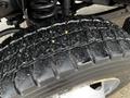 Close-up of a 2017 Ford F-550 tire showing tread pattern with visible wear and dirt on the rubber surface