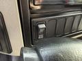 A close-up view of the control panel in a 2014 International TerraStar featuring an exhaust brake switch labeled EXH BRAKE with an ON button