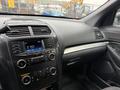 Interior view of a 2019 Ford Explorer dashboard featuring a touchscreen display and various controls for audio and climate settings