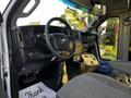 Interior view of a 2017 Chevrolet Express showing the steering wheel dashboard and driver seat with gray fabric upholstery