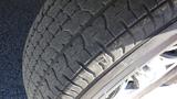 Close-up of a textured tire tread on a 2021 Grand Design Recreational 311BHS