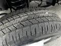Close-up of a tire tread from a 2021 Ford E-450 showing detailed grooves and patterns indicating wear and grip level