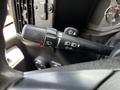 Close-up of the control lever for wipers and turn signals in a 2013 Chevrolet Express vehicle's interior