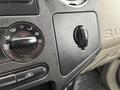 Interior controls of a 2010 Ford F-250 SD featuring a climate control knob and a dial for air settings