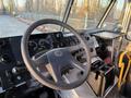 The interior cockpit of a 2017 Freightliner M Line featuring a steering wheel dashboard gauges and control panels