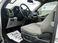 Interior of a 2017 Ford F-150 showing the driver's seat and dashboard with controls and displays