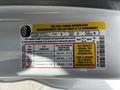 A label detailing tire and loading information for a 2018 Ford Transit featuring specifications for seating capacity and tire pressure guidelines