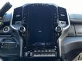 The interior dashboard of a 2022 RAM 3500 featuring a large touchscreen display with various buttons and controls below it