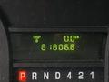 Display screen showing trip distance and total kilometers for a 2018 Ford Econoline with the readings of 0.0 km for trip B and 61806.8 km total