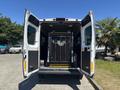 2016 RAM Promaster with open rear doors revealing a hydraulic lift system and storage space inside the vehicle