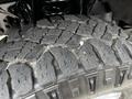 Close-up of a rugged tire tread on a 2020 Ford F-350 showcasing deep grooves and an aggressive pattern designed for off-road traction