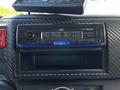 A JVC car stereo displaying "NO AUD DEVICE" with a Bluetooth connection option and a USB input in a vehicle interior