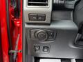 Control panel of a 2019 Ford F-150 featuring knobs and buttons for lights and other functions