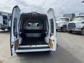 A 2010 Ford Transit Connect with open rear doors showcasing an empty cargo area