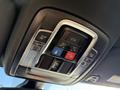 The overhead control panel in a 2023 RAM 3500 featuring buttons for assist, SOS, and vehicle functions along with light controls