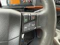Close-up of a 2012 Volvo VNL steering wheel featuring control buttons for answering and declining calls