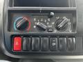 Control panel of a 2018 Hino 195 featuring climate controls and switches for various functions